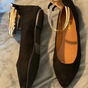 Black flats with gold ankle wrap